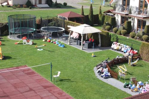 an aerial view of a backyard with a playground at Willa Klif in Rowy
