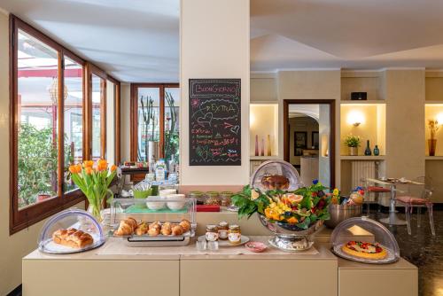 a kitchen with a counter with food on it at Albergo Minerva in Santa Margherita Ligure