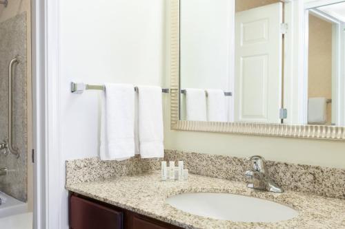 a bathroom with a sink and a mirror at Residence Inn by Marriott Laredo Del Mar in Laredo