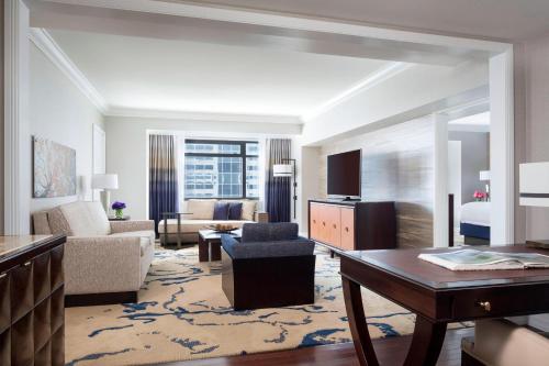 a large hotel room with a living room at The Ritz-Carlton, Denver in Denver