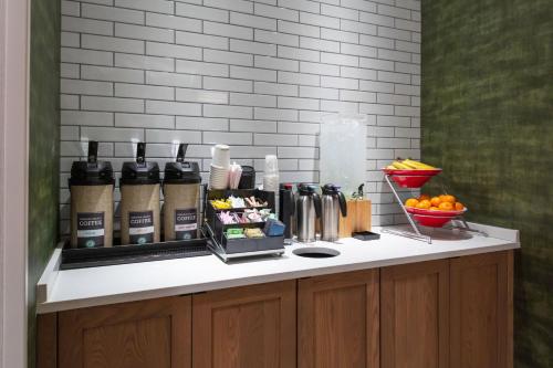 a kitchen counter with a bunch of food on it at Fairfield Inn & Suites by Marriott Atlanta Marietta in Marietta