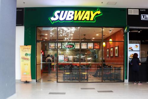 a subway restaurant with a sign on the front of it at BOHO Geniehome 3BR free W-ifi @ Utropolis ShahAlam in Shah Alam