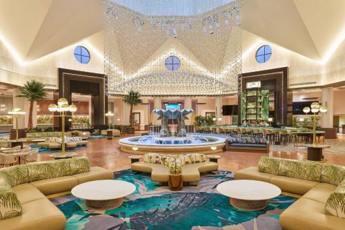 a lobby with a large fountain in the middle at Walt Disney World Dolphin in Orlando