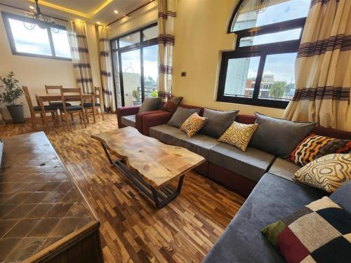 a living room with a couch and a table at Sora Addis BnB in Addis Ababa