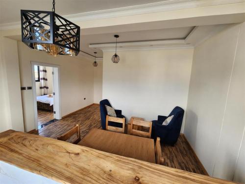 a dining room with a table and two chairs at Sora Addis BnB in Addis Ababa