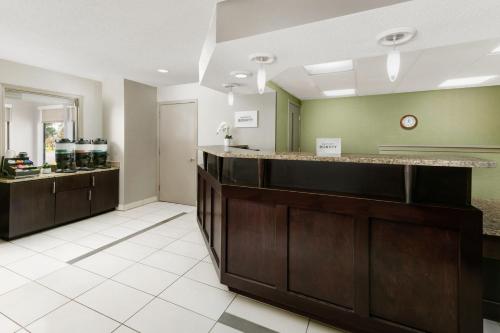 a large room with a kitchen with a counter at Residence Inn Detroit Troy/Madison Heights in Madison Heights