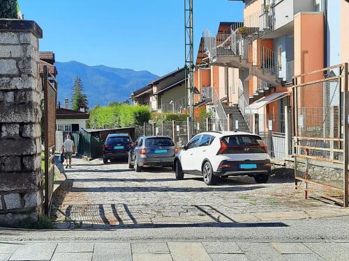 a group of cars parked on the side of a street at Appartamento Tennis in Cannero Riviera