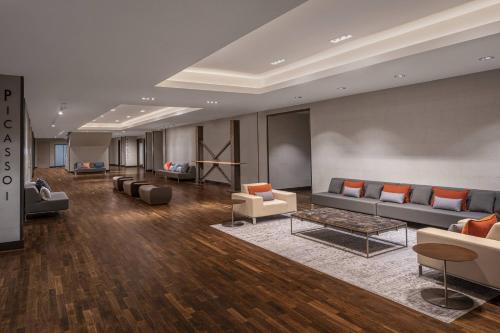 a large lobby with couches and chairs and a table at JW Marriott Houston Downtown in Houston