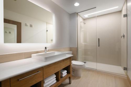 a bathroom with a sink and a toilet and a shower at Element Austin Round Rock in Round Rock