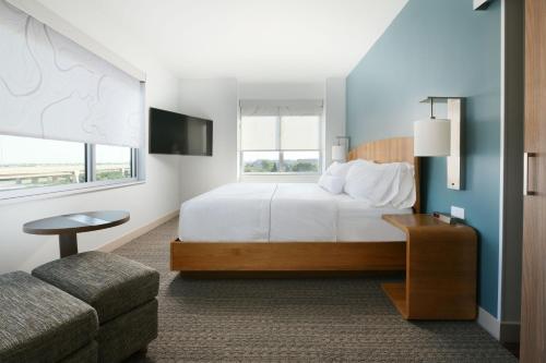 a hotel room with a bed and a couch at Element Austin Round Rock in Round Rock
