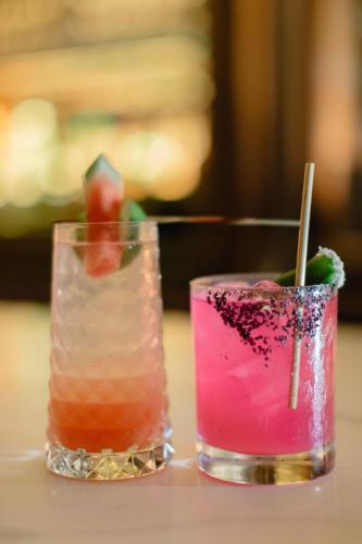 two cocktails sitting on top of a table at JW Marriott Houston Downtown in Houston