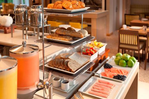 a buffet with different types of food and drinks at Residence Inn by Marriott Edinburgh in Edinburgh