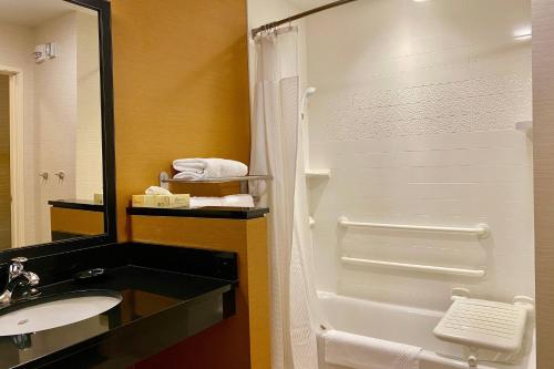 a bathroom with a shower and a sink at Fairfield by Marriott The Dalles in The Dalles