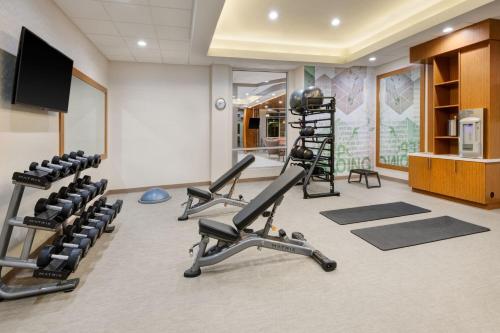 a gym with treadmills and exercise equipment in a room at SpringHill Suites by Marriott Weatherford Willow Park in Willow Park