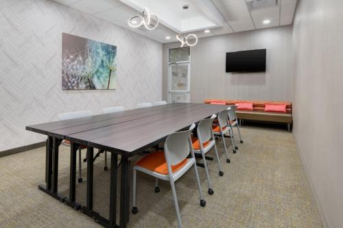 a conference room with a large table and chairs at SpringHill Suites by Marriott Weatherford Willow Park in Willow Park