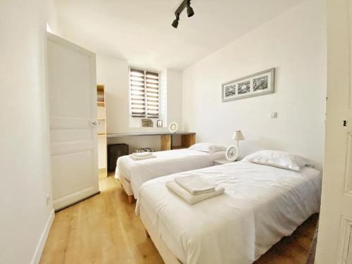 Posteľ alebo postele v izbe v ubytovaní Appt. T3 type Haussmannien vue mer sur port