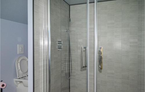 a shower stall in a bathroom with a toilet at 4 Bedroom Beautiful Home In Garein in Garein