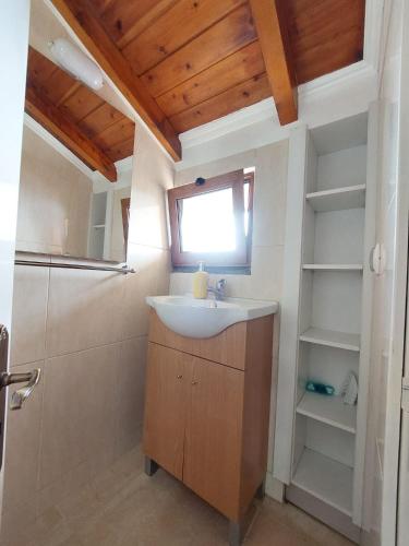 a bathroom with a sink and a shower at Fantatic Holiday House in Ponta Delgada