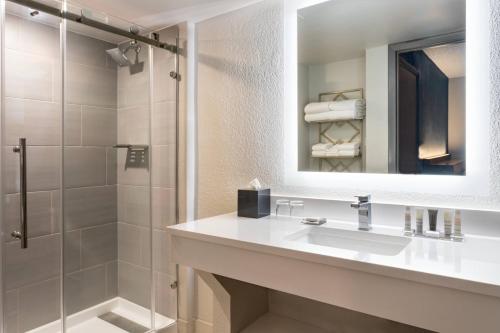 a bathroom with a sink and a shower at Marriott Hutchinson Island Beach Resort, Golf & Marina in Stuart