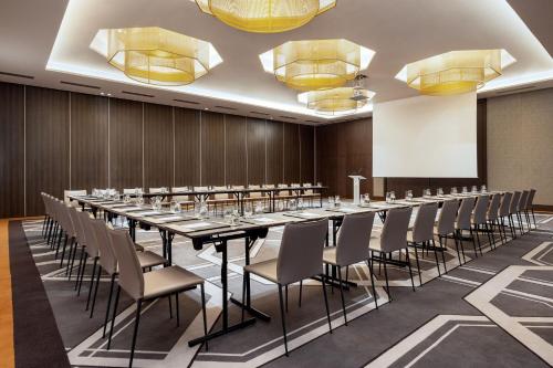 a large conference room with a long table and chairs at Rabat Marriott Hotel in Rabat