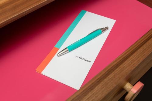 a pen sitting on top of a piece of paper at Le Meridien New York, Fifth Avenue in New York