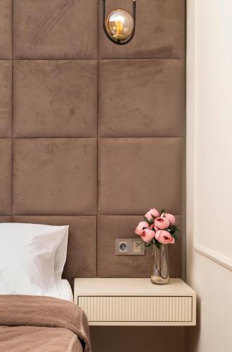 Postel nebo postele na pokoji v ubytování Dekaderon Lux Apartments
