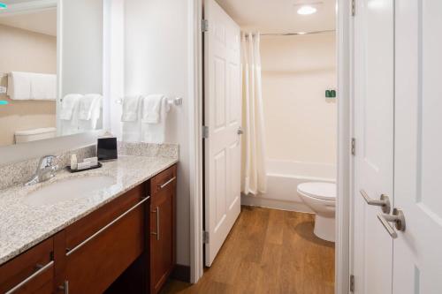 a bathroom with a sink and a toilet at Residence Inn Seattle East/Redmond in Redmond