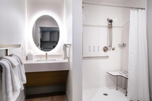 a white bathroom with a sink and a mirror at TownePlace Suites by Marriott Madison West, Middleton in Madison