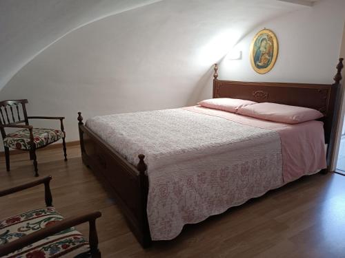 Ένα ή περισσότερα κρεβάτια σε δωμάτιο στο Nonno Nunzio House