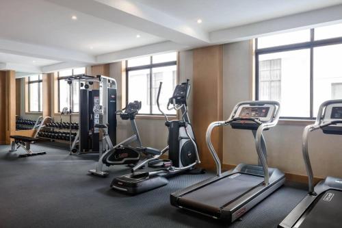 a gym with treadmills and elliptical machines at Fairfield by Marriott Shanghai Jingan in Shanghai