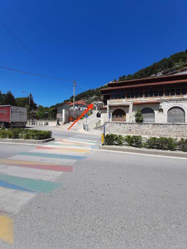 an empty street in front of a building at Guest House Noah&Kristel in Berat
