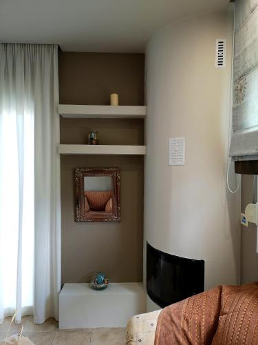 a living room with a couch and a television at Elioj house in Leptokaria