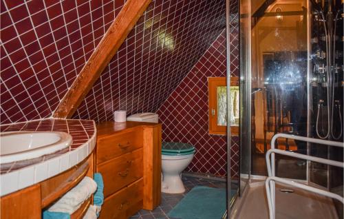 a bathroom with a toilet and a sink and a shower at Beautiful Home In Lezardrieux With 2 Bedrooms And Wifi in Lézardrieux