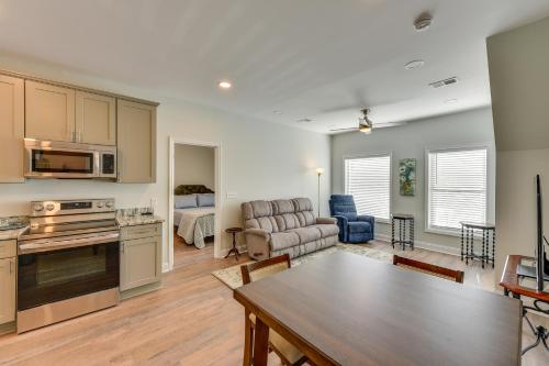 a kitchen and living room with a couch and a table at Walk to Old Town Quiet Bluffton Vacation Rental in Bluffton