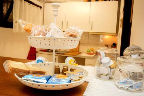 a kitchen counter with a basket of food on a table at Behind On The Canalside Venice in Venice