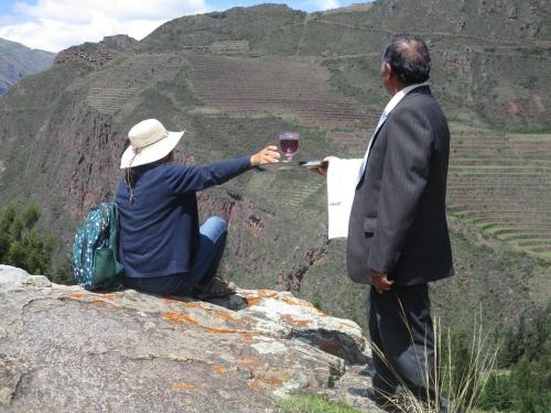 a man and a woman sitting on top of a mountain at Casa de Oren in Pisac