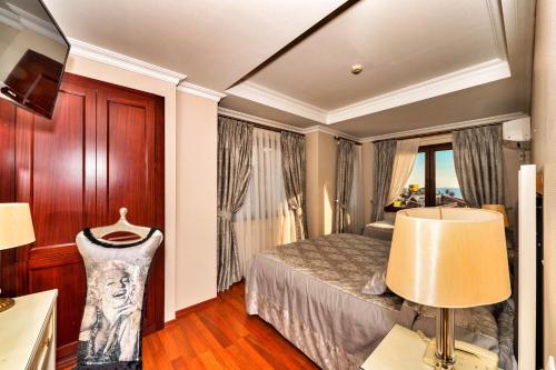Letto o letti in una camera di Hotel Daphne