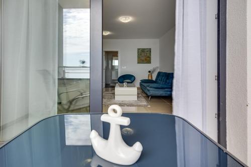 a glass table with a white toy on top of it at Villa Stjepanovic in Tribanj-Krušćica