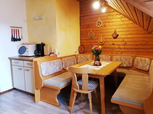 a small kitchen with a table and a table and a tableablish at Bergbauernhof Rebernig in Lendorf