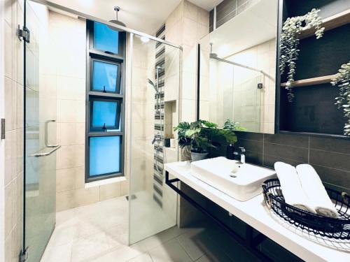 a bathroom with a sink and a shower at Zen Stay in Kuala Lumpur