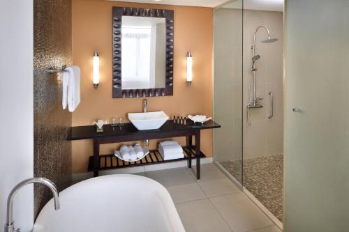 a bathroom with a sink and a shower at Accra Marriott Hotel in Accra