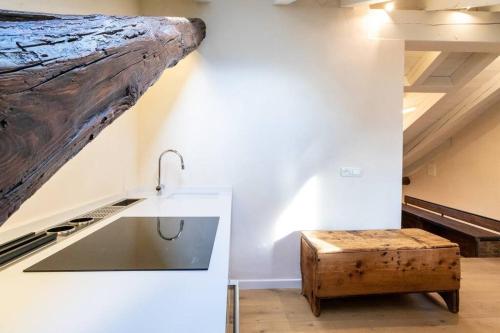 a kitchen with a log hanging from the ceiling at CRoix 1541 - CIR 0198 in Aosta