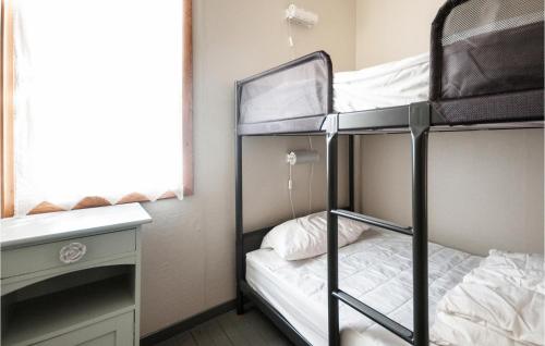 a room with two bunk beds and a window at Myrvang in Sollia