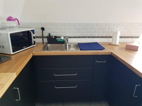 Kuchyňa alebo kuchynka v ubytovaní Les Embruns - Les plages - appartement 3eme étage