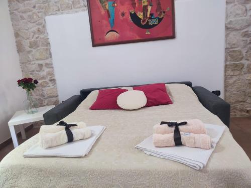 Ένα ή περισσότερα κρεβάτια σε δωμάτιο στο La casa nel vico
