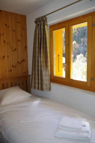 Chalet Mille Étoilesにあるベッド