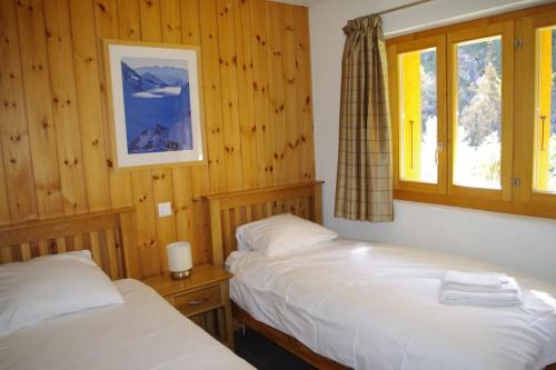 Postel nebo postele na pokoji v ubytování Chalet Mille Étoiles