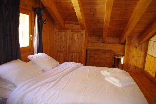 Chalet Mille Étoilesにあるベッド
