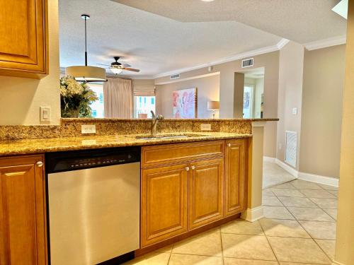 a kitchen with a sink and a dishwasher at Belle Harbor 803-M - Panoramic Views in Clearwater Beach