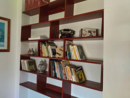 a book shelf filled with books in a room at Repose toi c comme chez soi in Oujda